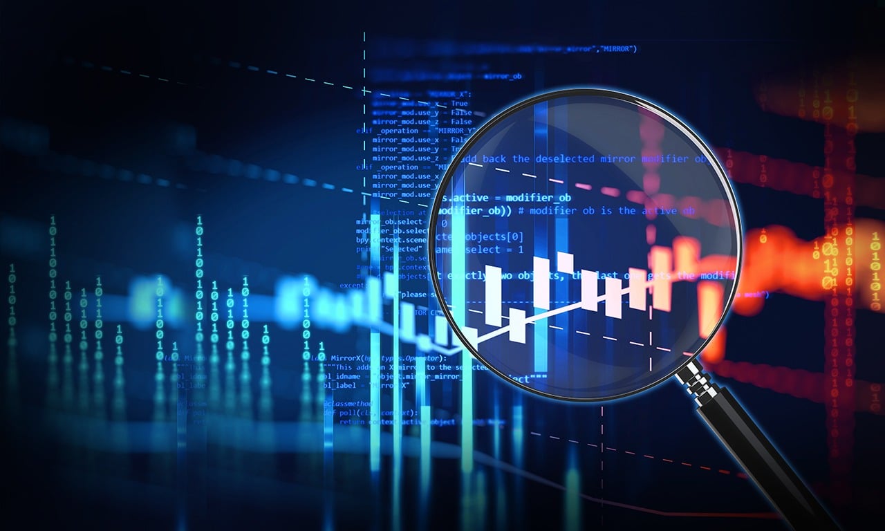 Candlestick charts under a magnifying glass