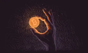 hand holding bitcoin in the dark